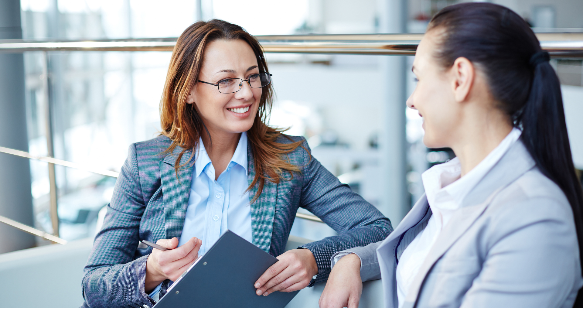 Two business women speaking